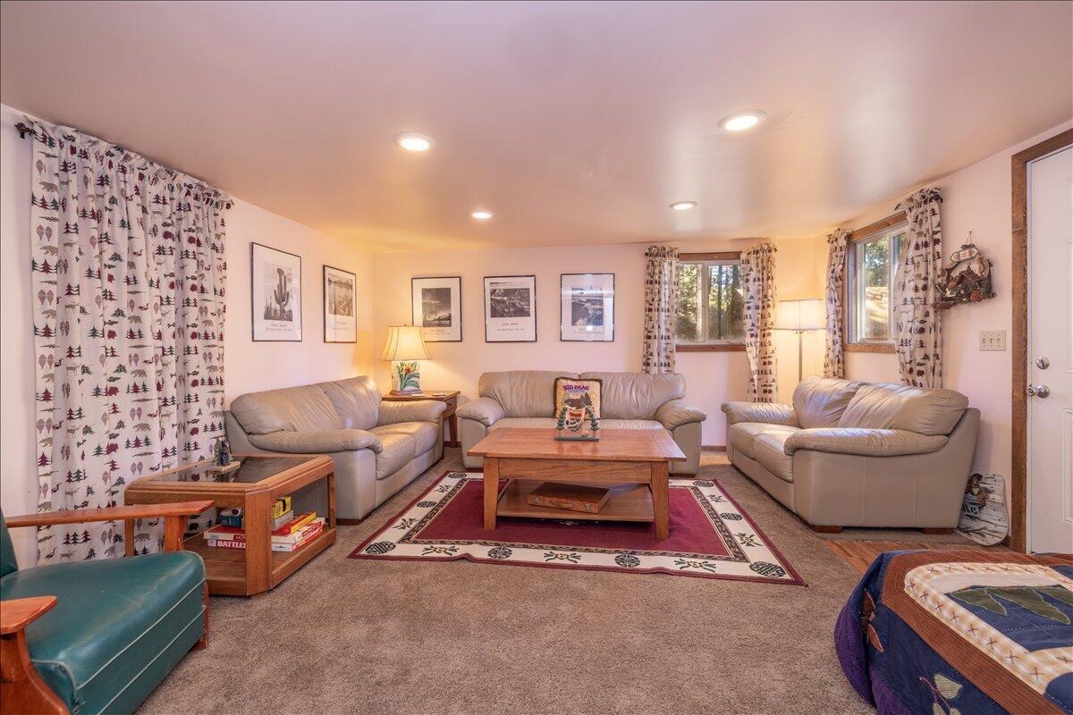 Finished 448 square foot outbuilding with recessed lighting, carpet, and seating area