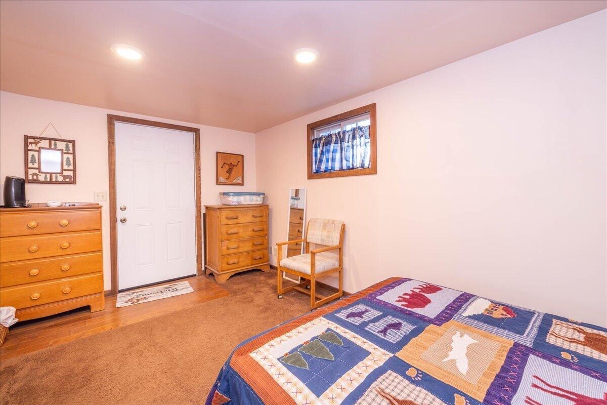 Bunk space in the finished outbuilding with twin bed and dresser