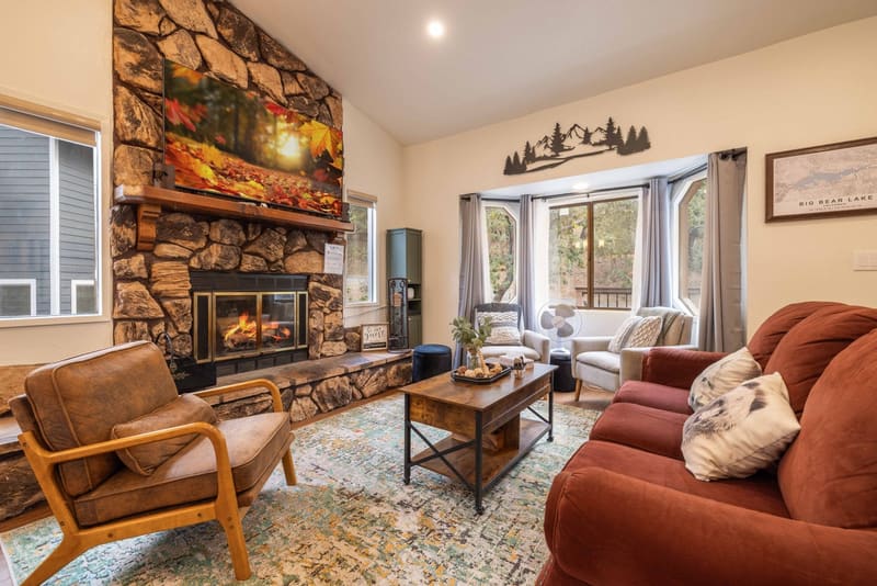 Living room with stone fireplace